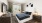 a bedroom with a bed and a tv