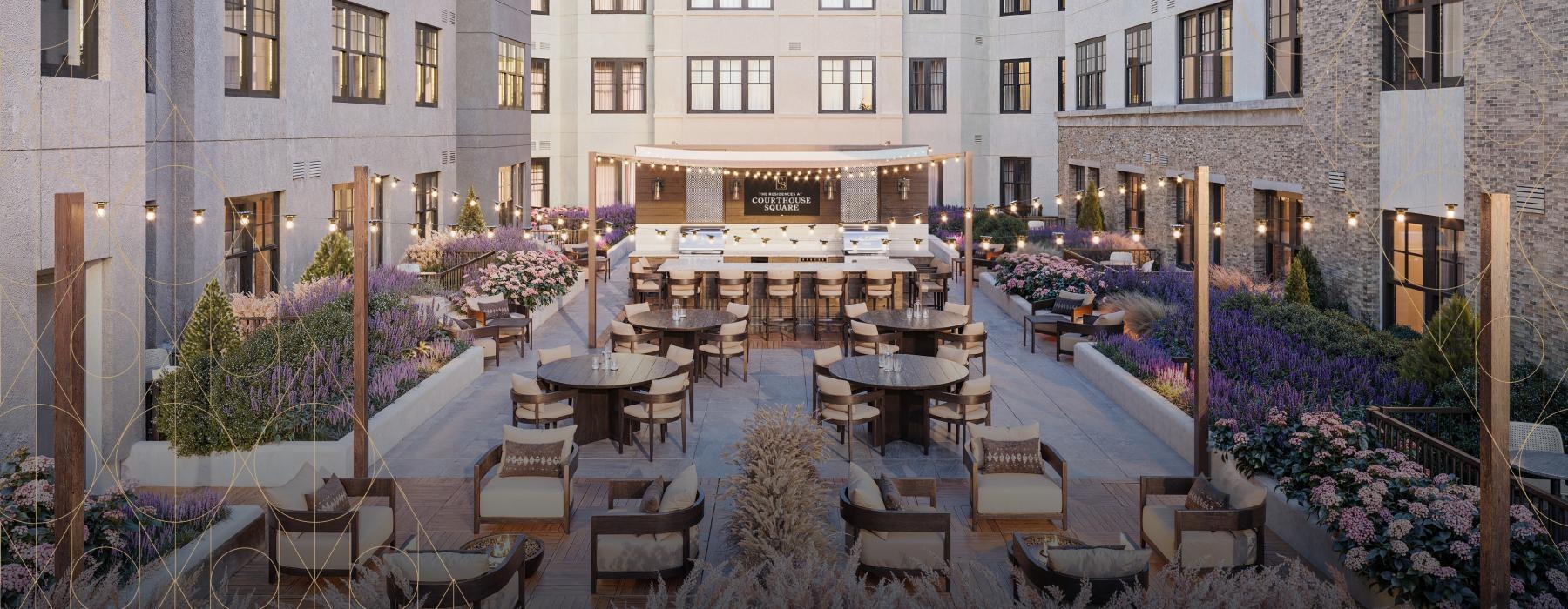 a courtyard with tables and chairs
