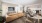 a living room with a couch and dining table