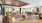 a clubhouse room with a large wood floor