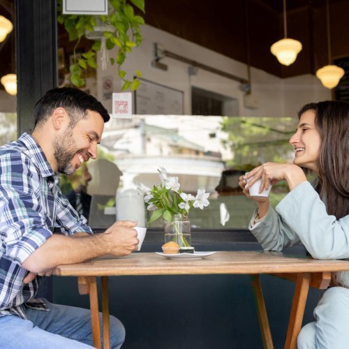 a man and a woman sitting at a table