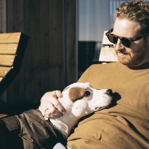 a man holding a dog